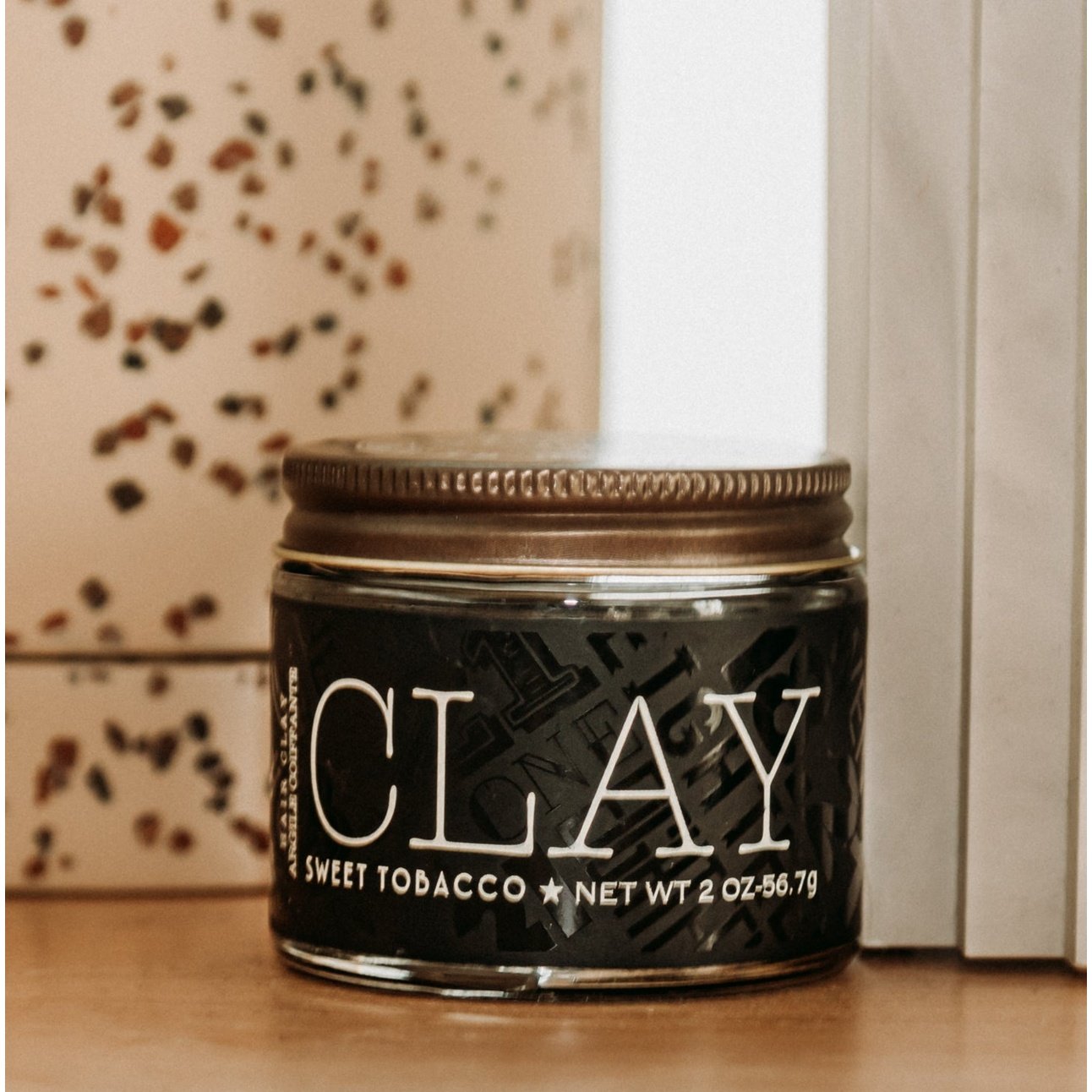 18.21 Man Made Hair Styling Clay Sweet Tobacco 2oz